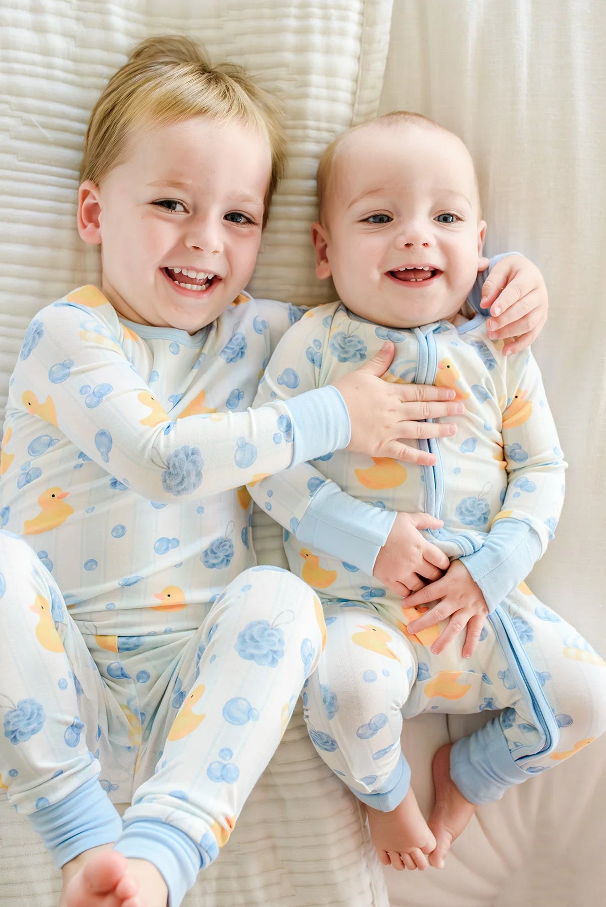Caden Lane | Bubble Duckies Blue Convertible Bamboo Zip Romper | 0-3m